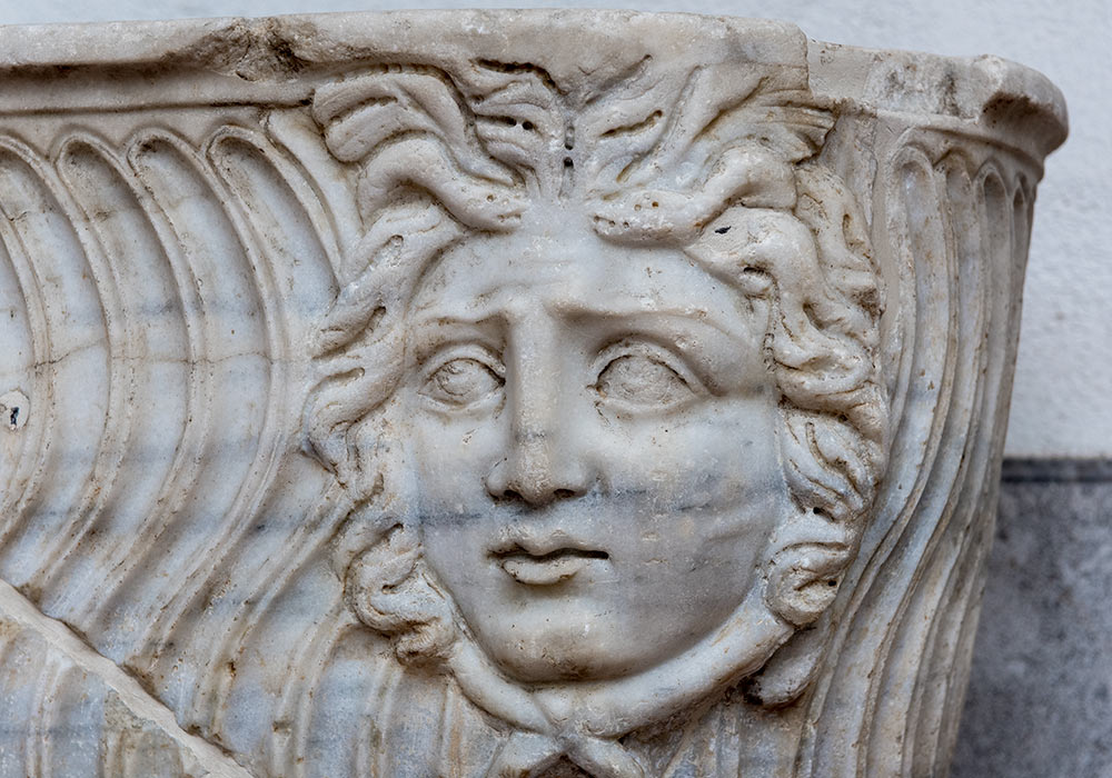 Medusa head on a marble sarcophagus