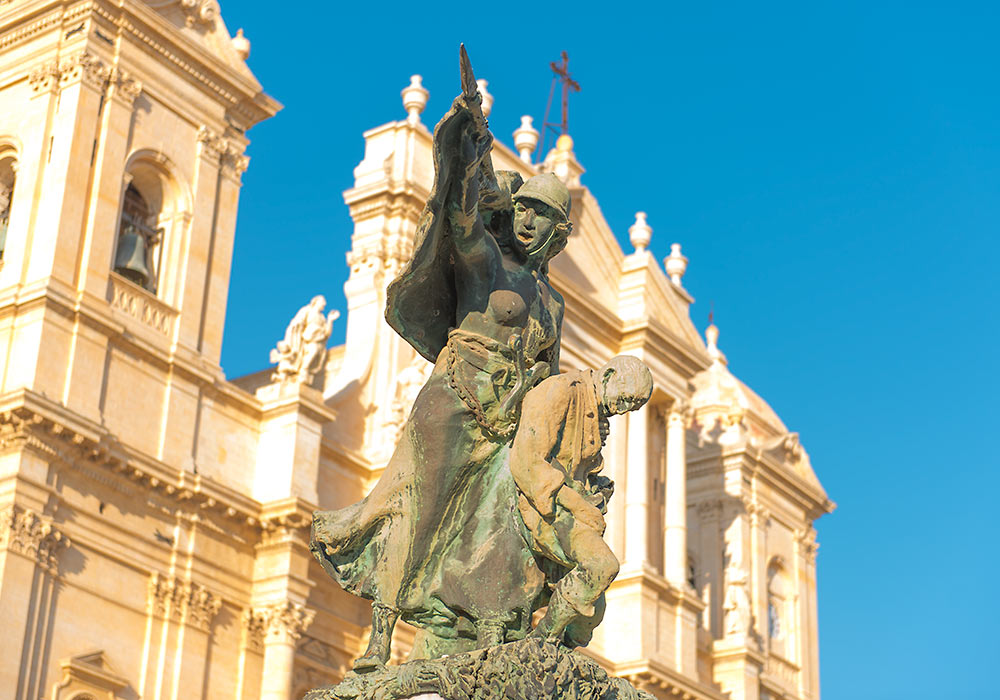 WWI Memorial in front of the cathedral in Noto.