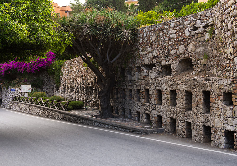 Byzantine tomb-recesses in the wall on Via Pirandello, Taormina.